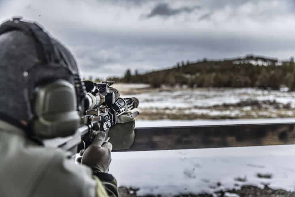 Thunder Ranch’s Long Range Scoped AR course is designed to push the boundaries of what modern semi-auto AR platforms can achieve in precision shooting. This course will expose you to the capabilities and constraints of your rifle, ensuring you leave with the skills and knowledge to engage threats from close quarters to extended ranges up to 700 yards.

You’ll explore the practical application of extended-range marksmanship with an AR, traditionally a role for bolt-action rifles. The course addresses critical elements for rapid engagement of targets at different distances.

This is not a basic marksmanship course, though new shooters are welcomed; it’s a dynamic, problem-solving class where you’ll shoot, move, and engage multiple threats under tight time constraints. The training includes runs on the Punisher, focusing on shooting from various positions, dialing, and using hold-offs.

The course primarily focuses on AR-style rifles in 5.56. Other acceptable platforms include AKs and SCARs with magnified optics. Ideal optics range from low to mid-power (1-8, 2.5-10, 3-15, etc.), though Red Dots with magnifiers can be used with limitations. High-quality optics with MIL-based reticles and premium ammunition are recommended, along with bipods and slings. 20-round magazines may offer advantages at times.

Prepare for a challenging course which will test your equipment and push your personal limits, making you a more capable and confident marksman.

The course primarily focuses on AR-style rifles in .223 configured as Designated Marksman Rifles (DMR). Other acceptable platforms include AKs and SCARs with magnified optics. Ideal optics range from low to mid-power (1-8, 2.5-10, 3-15, etc.), though Red Dots with magnifiers can be used with limitations. High-quality optics with MIL-based reticles and premium ammunition are recommended, along with bipods and slings, though 20-round magazines may offer advantages at times.

Prepare for a challenging, real-world training experience that will enhance your precision shooting skills and tactical abilities. This course will test your equipment and push your personal limits, making you a more capable and confident marksman.