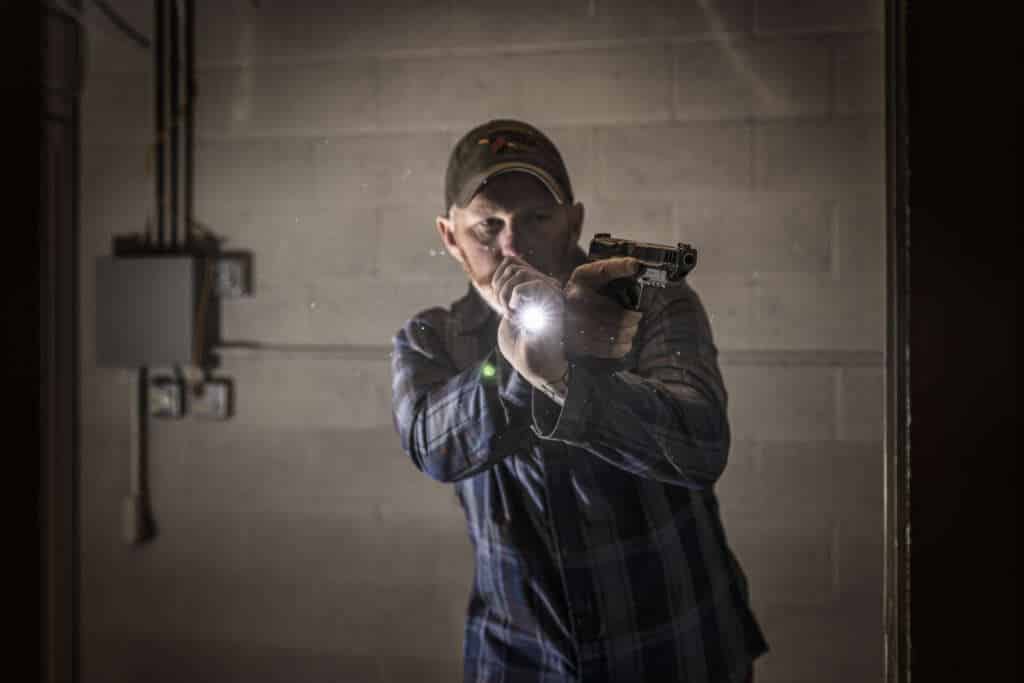 Thunder Ranch’s Defensive Handgun Low Light course parallels the training of DH1 and DH2, focusing on the critical skills needed to use handguns with handheld and weapon-mounted lights in low light conditions. Recognizing that defensive encounters often occur in low, altered, or failing light, this course prepares you to handle such scenarios.

Students will learn to choose and use the right tools and equipment, integrating them in the dark. This training goes beyond basic flashlight techniques, emphasizing practical application. You will engage in exercises that challenge your ability to navigate and respond to threats in varied lighting conditions.

The course includes drills on the flat range, inside the Terminator shoot-house, and in varied urban and rural terrain.

Defensive Handgun Low Light ensures you are equipped to handle situations where lighting is compromised.